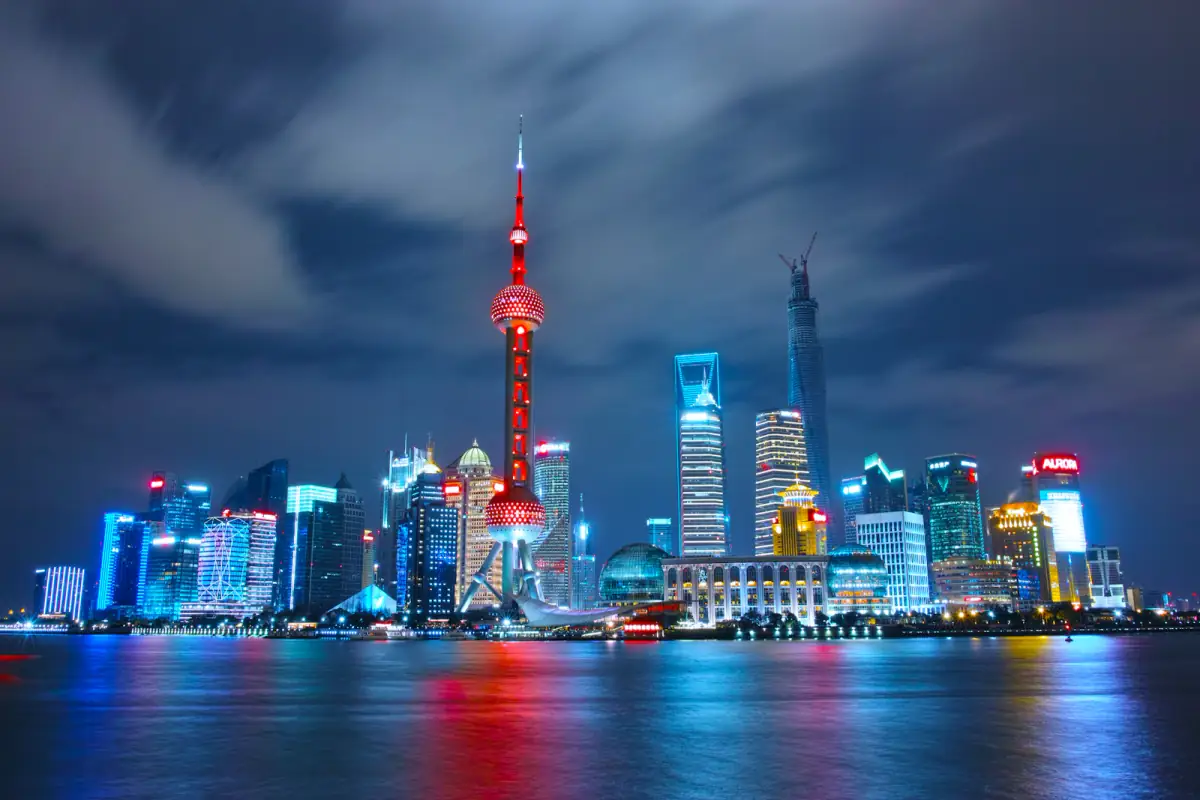 Shanghai's illuminated modern skyline reflected in the Huangpu River
